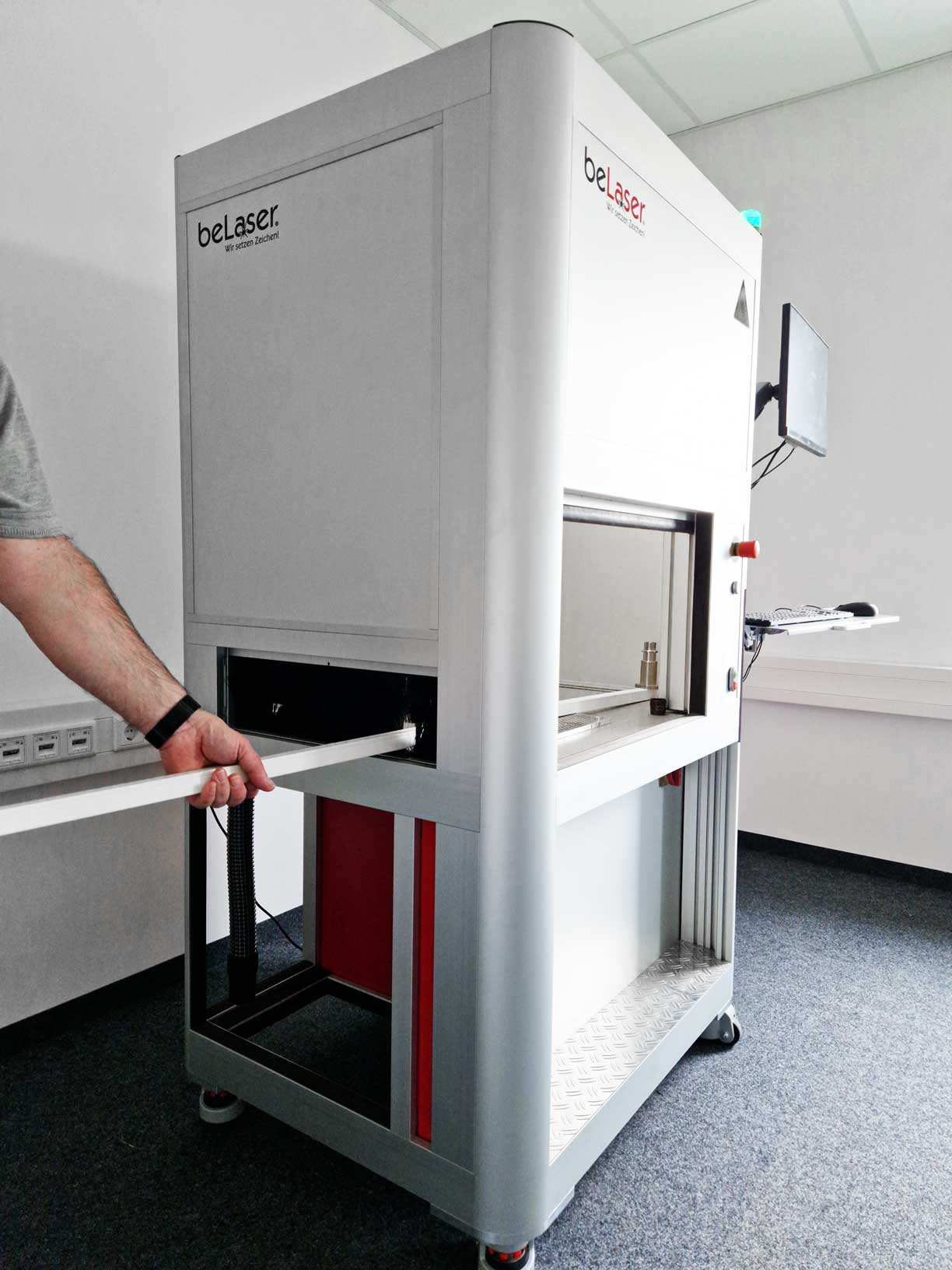 Laser engraving machine with open side pass-through and brush curtain